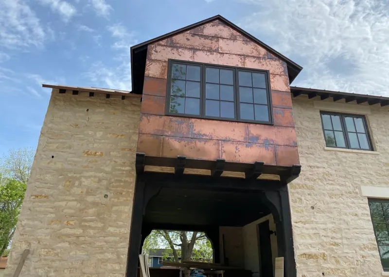 Copper metal panel facade on a stone building for Metal Roof Coating in Rockwood